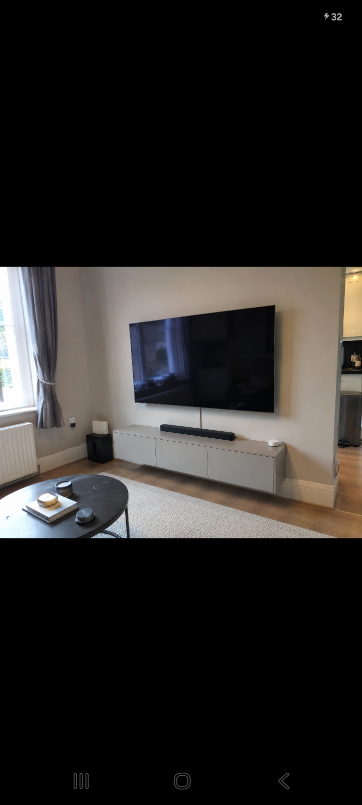 Wall-mounted TV with cables neatly hidden